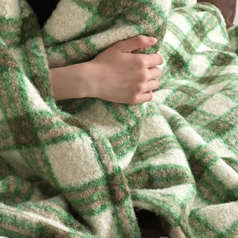 Cuddly blanket with checked pattern and pompom decoration Stornfield