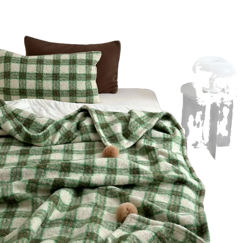 Cuddly blanket with checked pattern and pompom decoration Stornfield