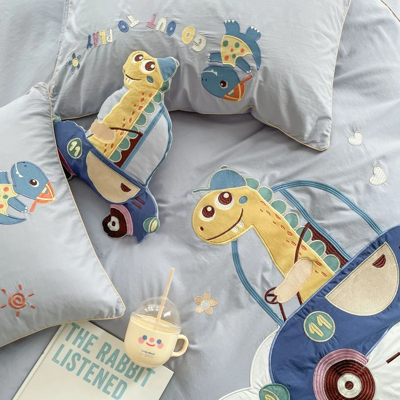 Children's bedding set with embroidered dinosaur and car appliqués Stornfield