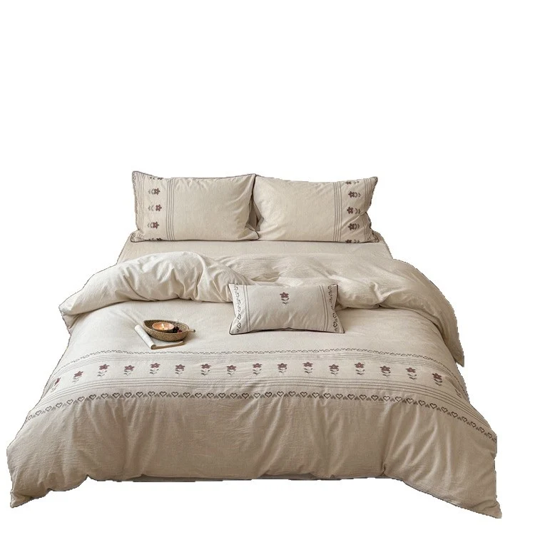 Cotton-linen bedding set with embroidered floral border decor Stornfield