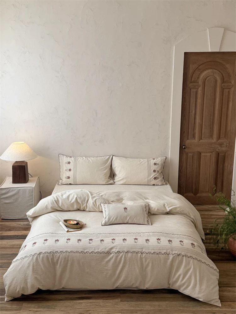 Cotton-linen bedding set with embroidered floral border decor Stornfield