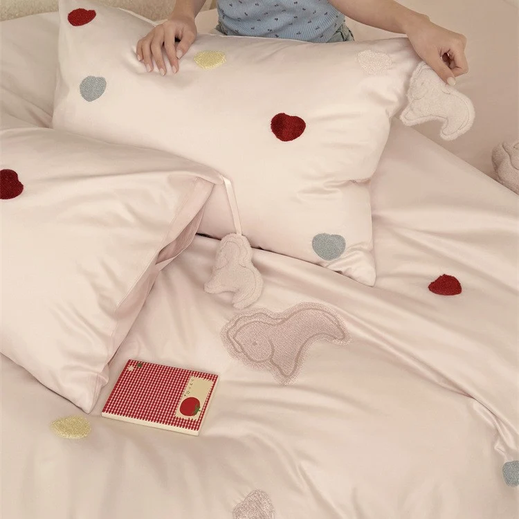 Reversible cotton satin bedding with embroidered heart appliqués and silky-matte finish Stornfield