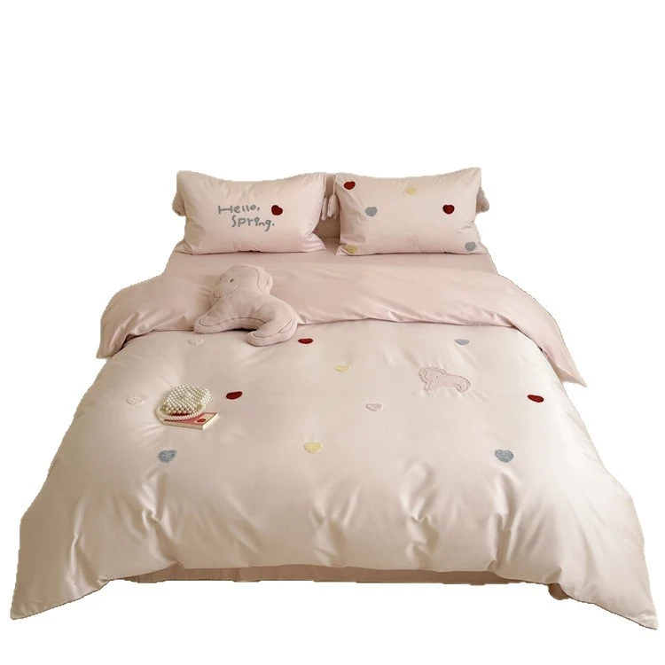 Reversible cotton satin bedding with embroidered heart appliqués and silky-matte finish Stornfield