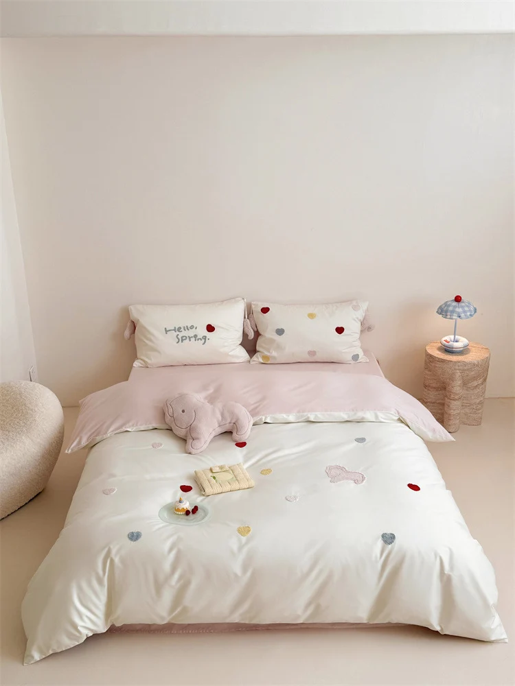 Reversible cotton satin bedding with embroidered heart appliqués and silky-matte finish Stornfield