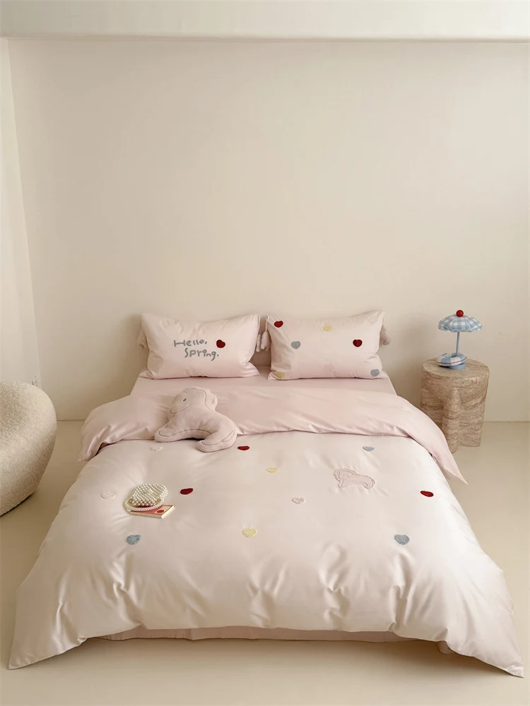 Reversible cotton satin bedding with embroidered heart appliqués and silky-matte finish Stornfield