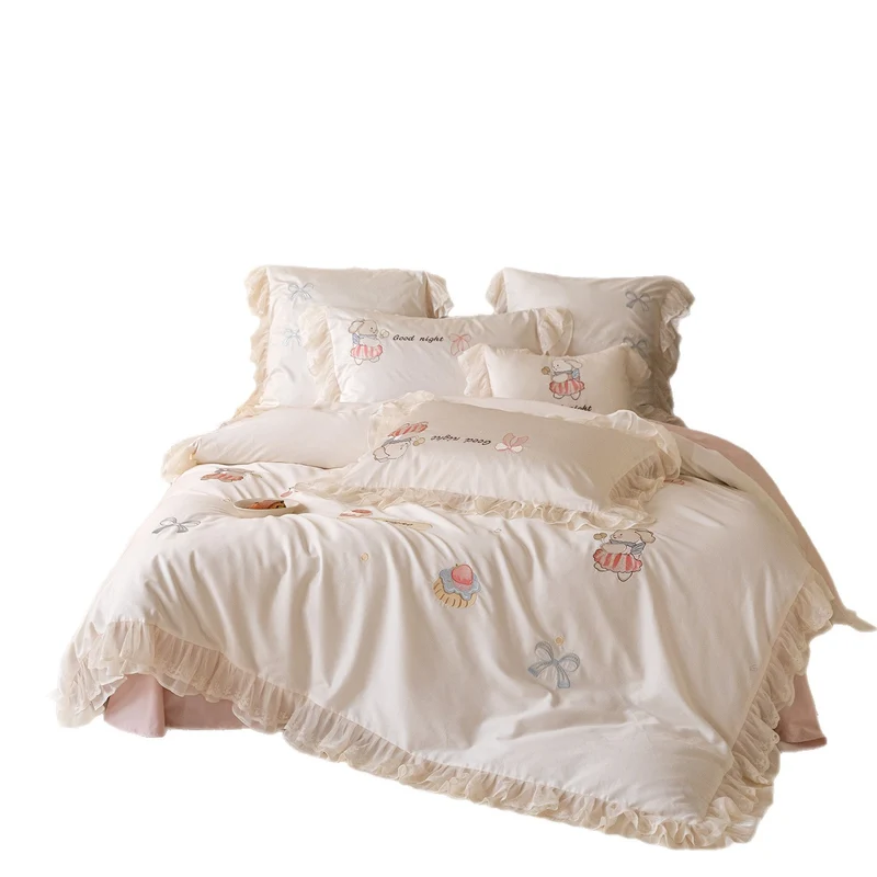 Playful cotton satin bed linen set with ruffled hem and detailed embroidery Stornfield