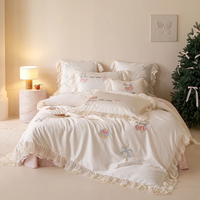 Playful cotton satin bed linen set with ruffled hem and detailed embroidery Stornfield