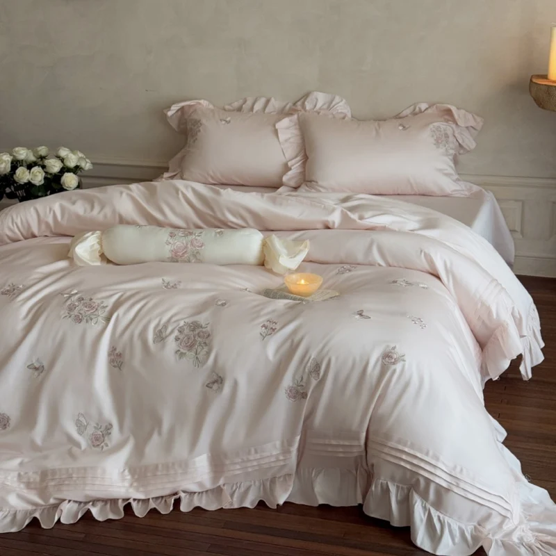 Romantic satin duvet cover set with ruffled trim, rose embroidery, and decorative pillow Stornfield