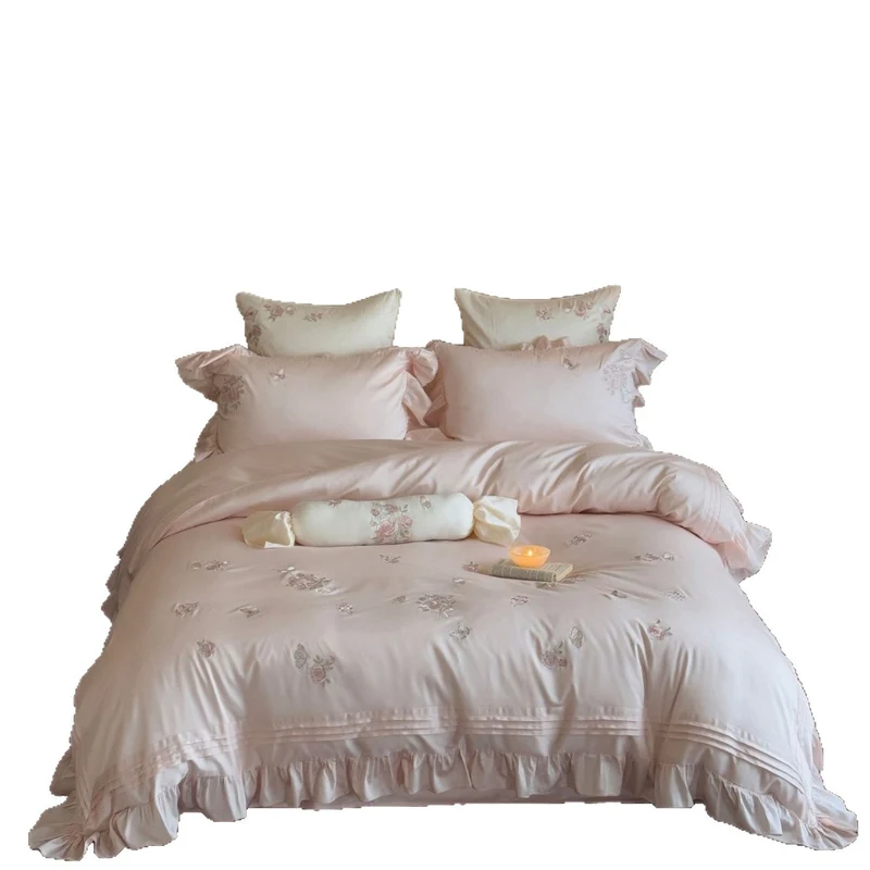 Romantic satin duvet cover set with ruffled trim, rose embroidery, and decorative pillow Stornfield