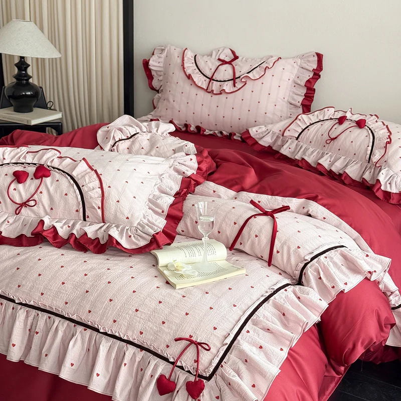 Romantic cotton bedding set with ruffle, heart embroidery and decorative pillow Stornfield