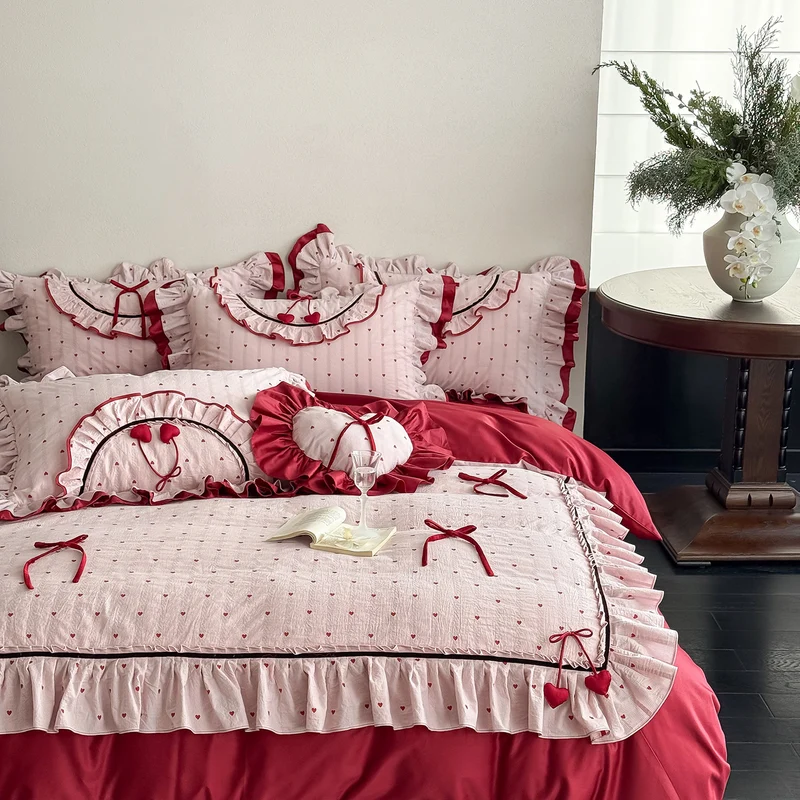 Romantic cotton bedding set with ruffle, heart embroidery and decorative pillow Stornfield