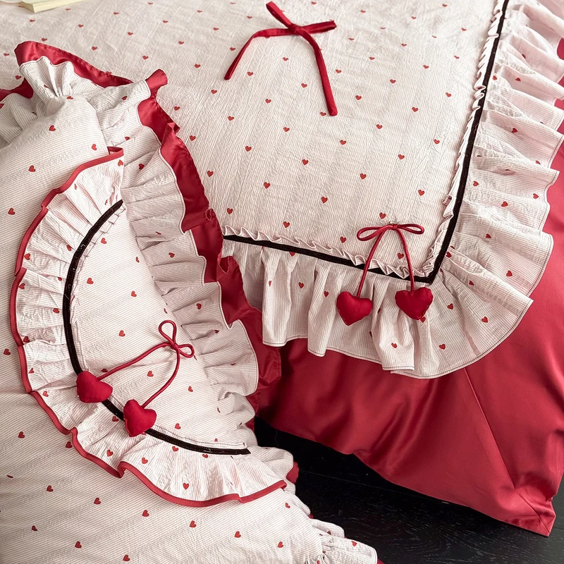 Romantic cotton bedding set with ruffle, heart embroidery and decorative pillow Stornfield