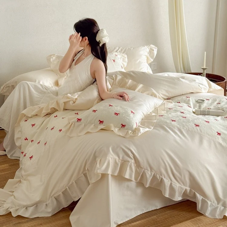 Romantic cotton satin bed linen set with ruffle, decorative panel and delicate animal print Stornfield
