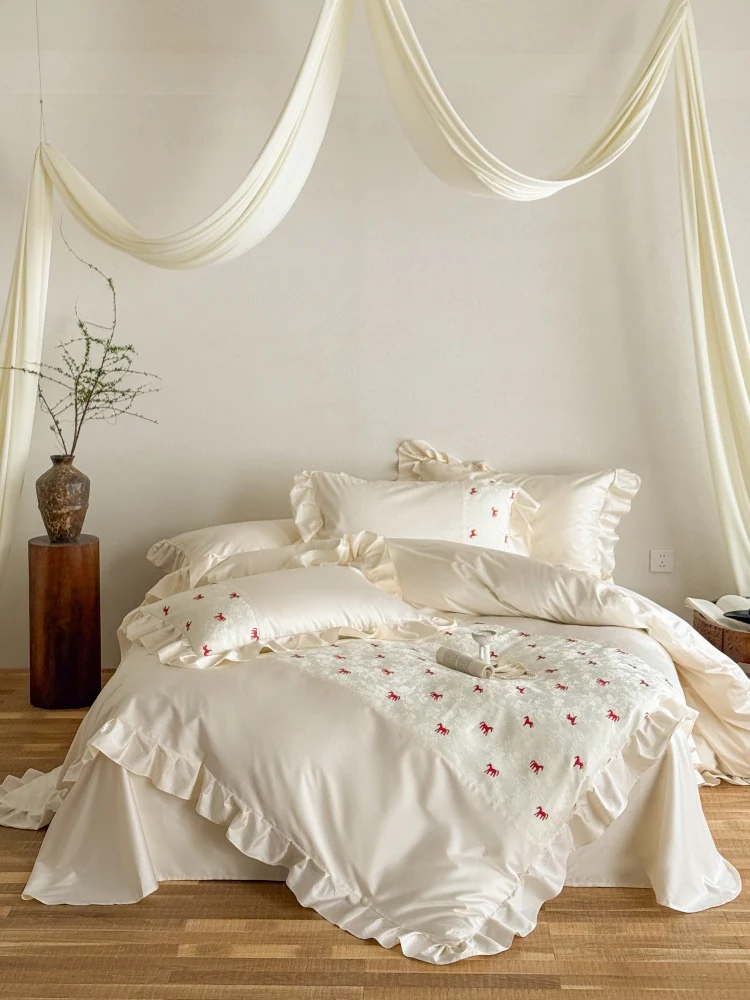 Romantic cotton satin bed linen set with ruffle, decorative panel and delicate animal print Stornfield