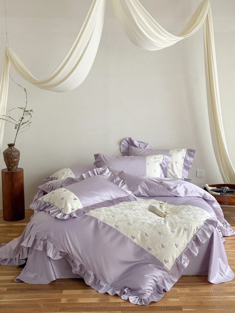 Romantic cotton satin bed linen set with ruffle, decorative panel and delicate animal print Stornfield