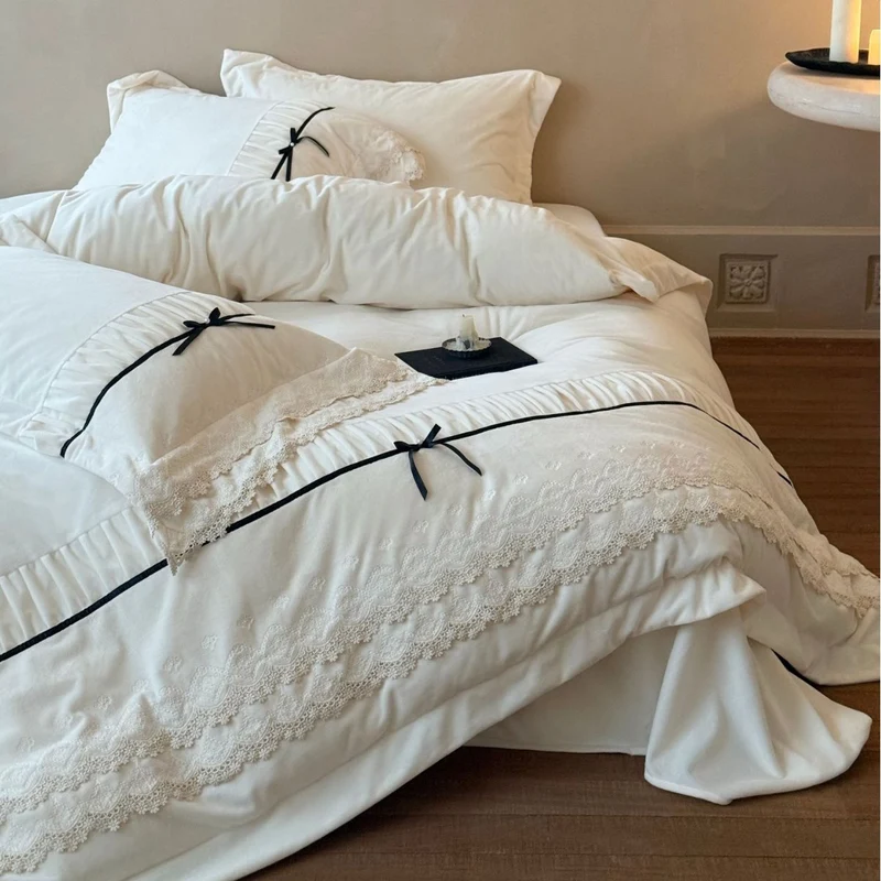 Romantic cotton satin bed linen set with ruffled hem, lace trim and decorative ribbons Stornfield