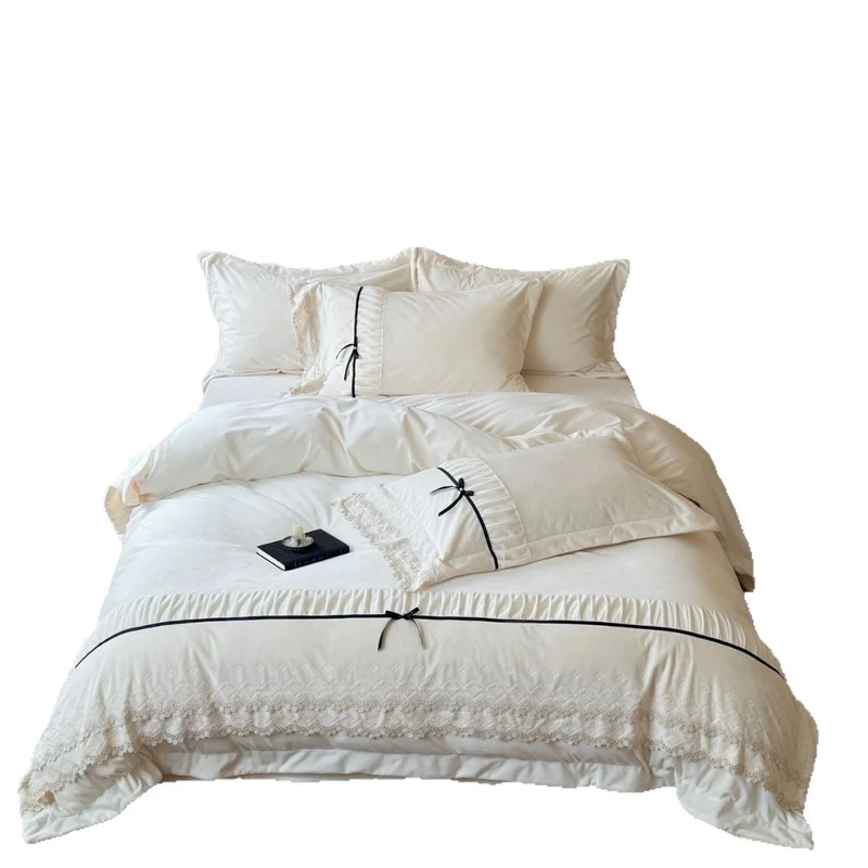 Romantic cotton satin bed linen set with ruffled hem, lace trim and decorative ribbons Stornfield