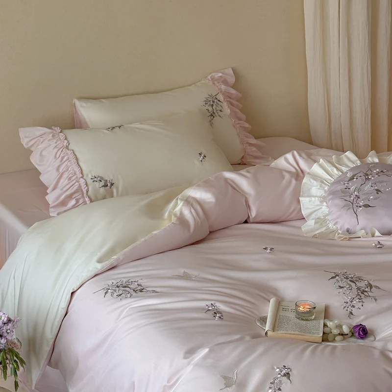 Luxurious satin bedding set with ruffles and delicate floral embroidery Stornfield