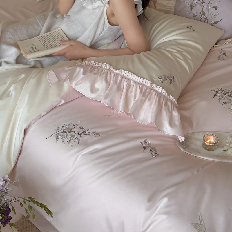 Luxurious satin bedding set with ruffles and delicate floral embroidery Stornfield
