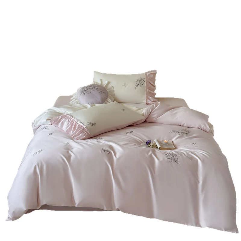 Luxurious satin bedding set with ruffles and delicate floral embroidery Stornfield