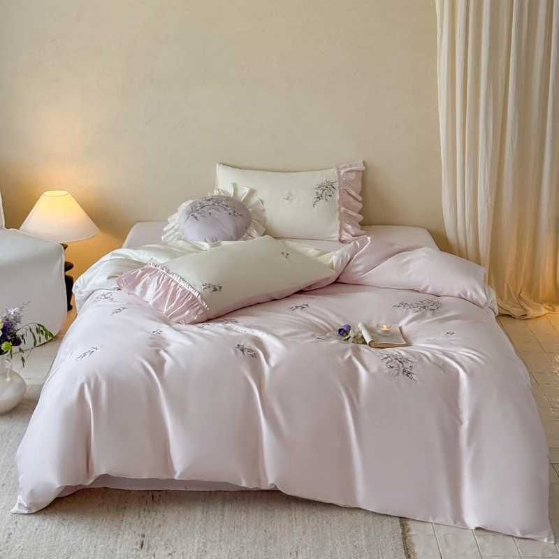 Luxurious satin bedding set with ruffles and delicate floral embroidery Stornfield