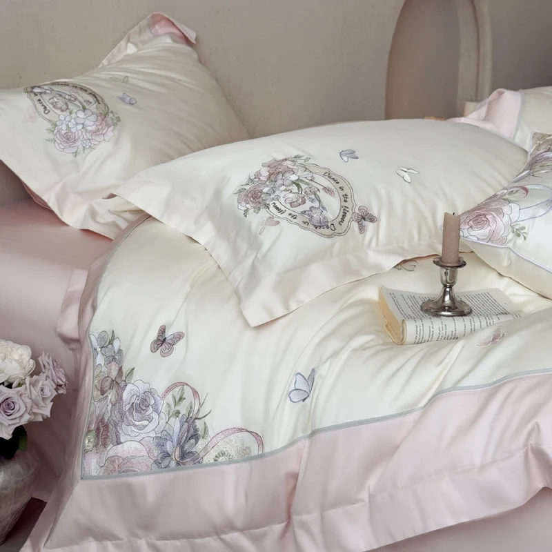 Luxurious floral embroidered cotton satin bedding set with ruffle and decorative pillow Stornfield