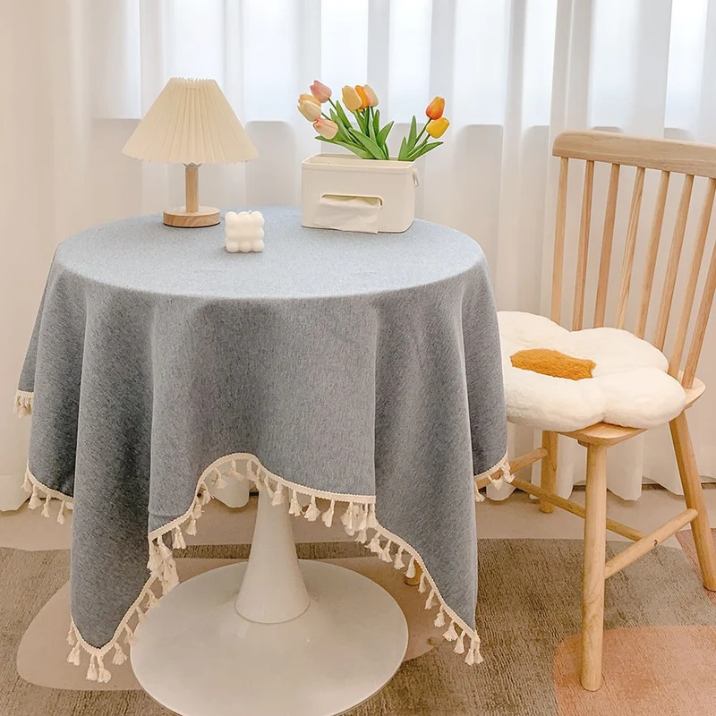 Runde strukturierte Tischdecke mit Quastenbesatz und Leinen-ähnlichem Drapierfinish
