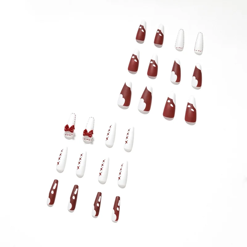 Kunstvolle Stiletto-Nägel mit Schleifen- und Zickzackdesign Karnz