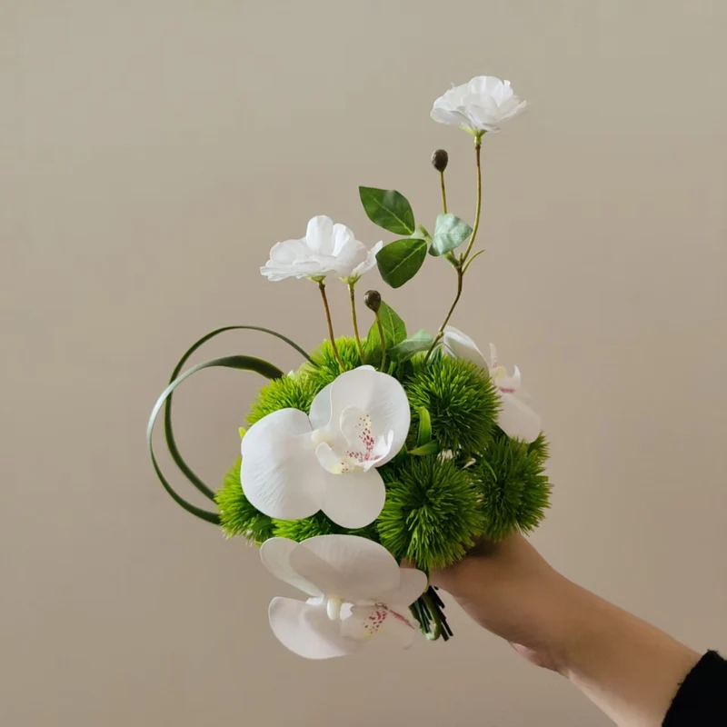 Lifelike Orchid and Greenery Floral Arrangement