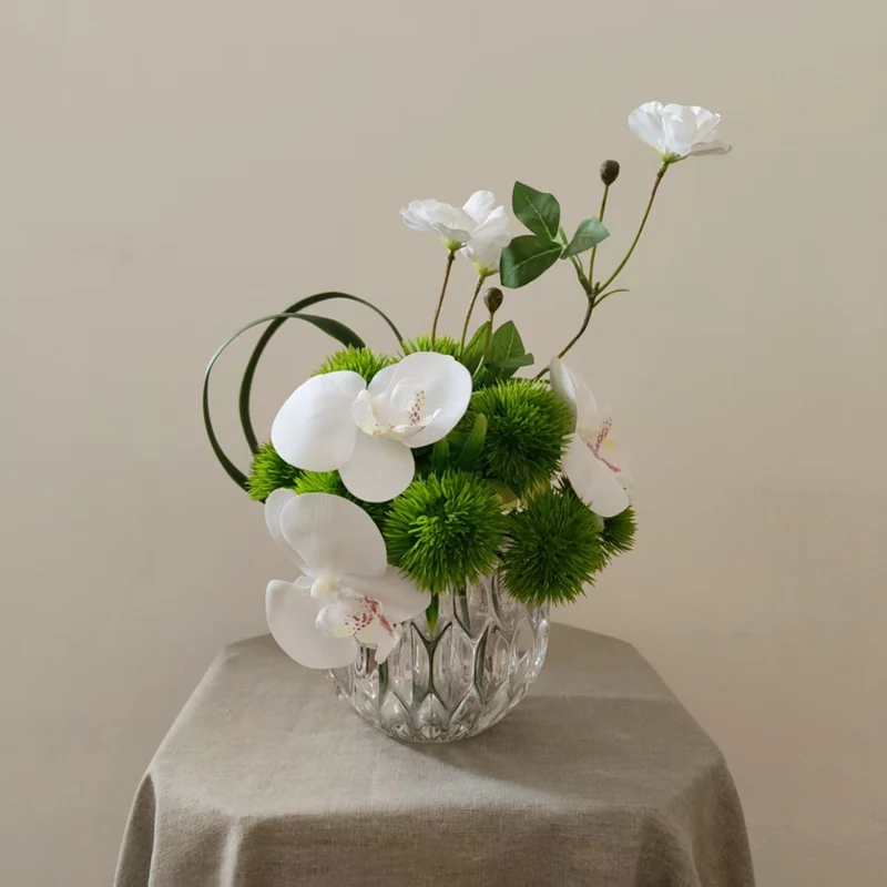 Lifelike Orchid and Greenery Floral Arrangement