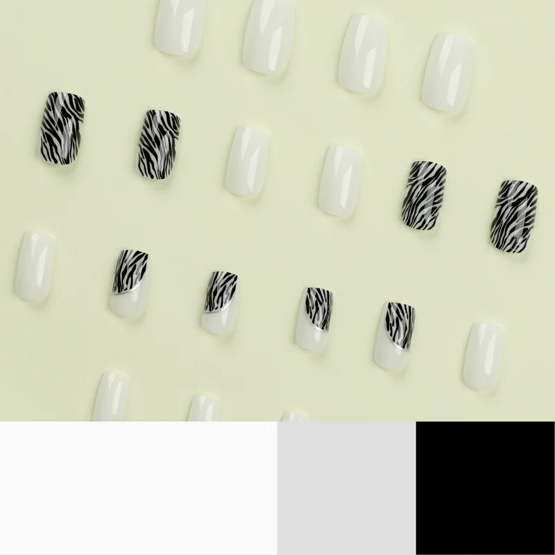 Kunstvolle Nagelverlängerungen mit stilvollem Zebra-Muster Karnz