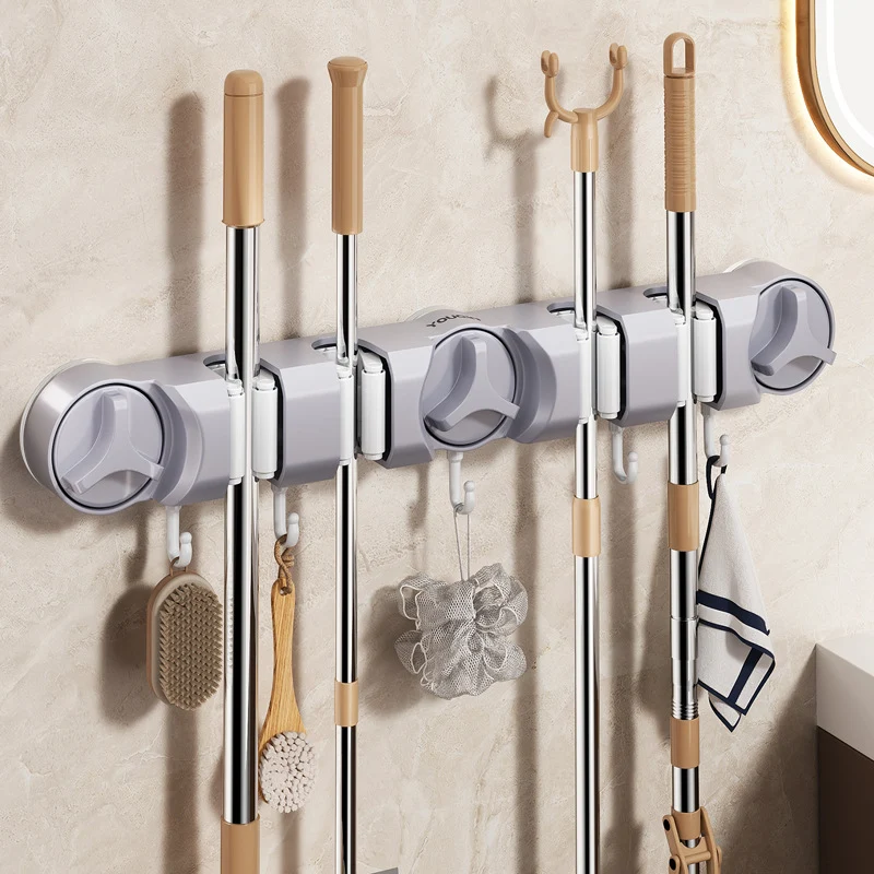 Suction cup holder for broom and mop