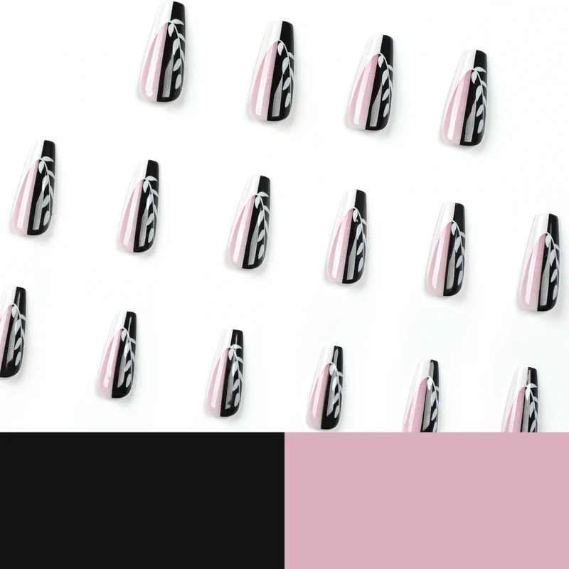 Kunstvolle Nagelverlängerungen im eleganten Schwarz-Weiß-Design Karnz