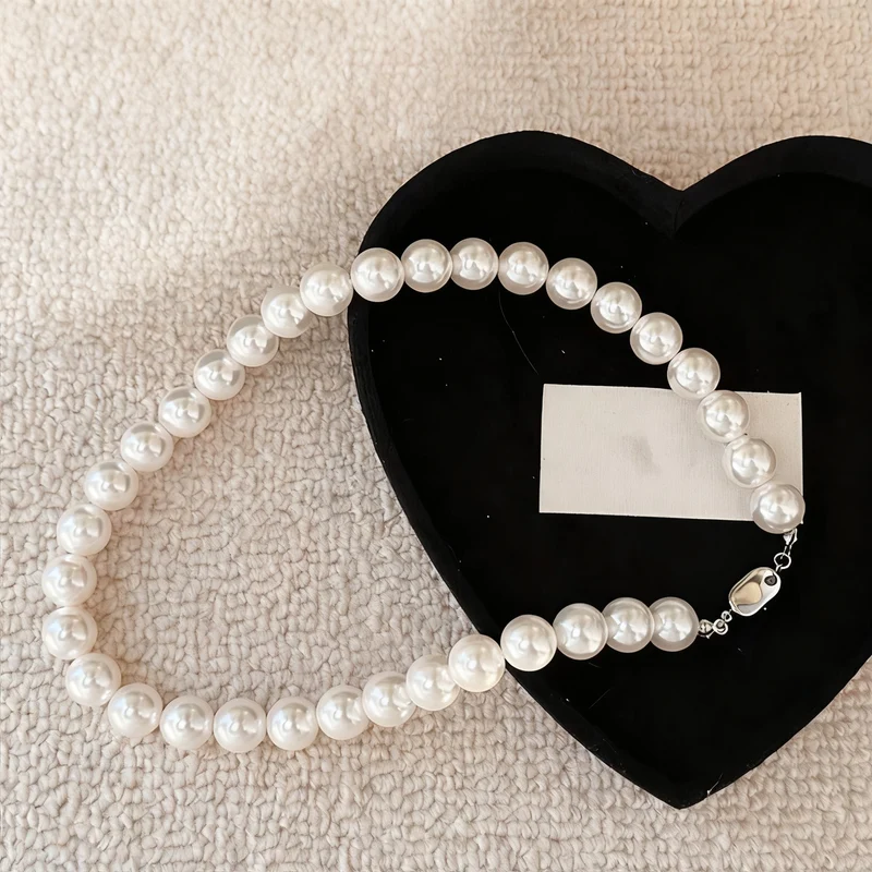 Pearl necklace with silver clasp, pearls 4–12 mm
