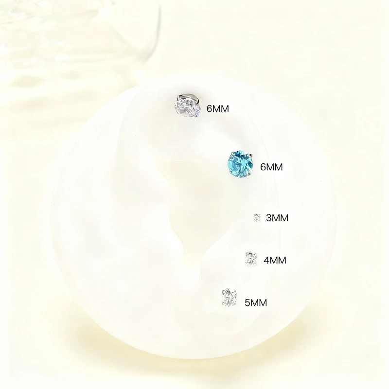 Titanium alloy earrings with zirconia, screw closure