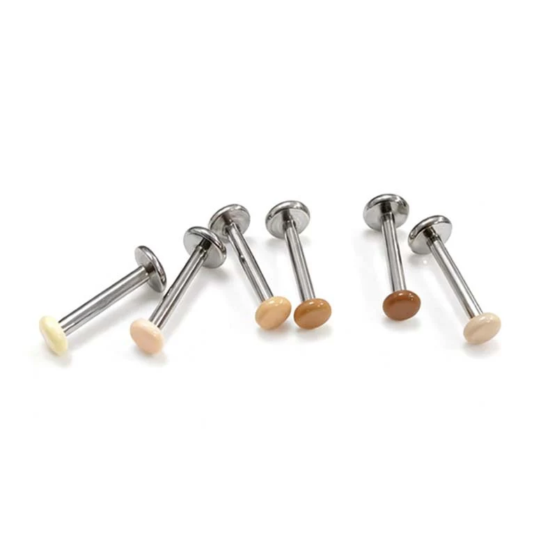Titanium alloy earrings with zirconia, screw closure