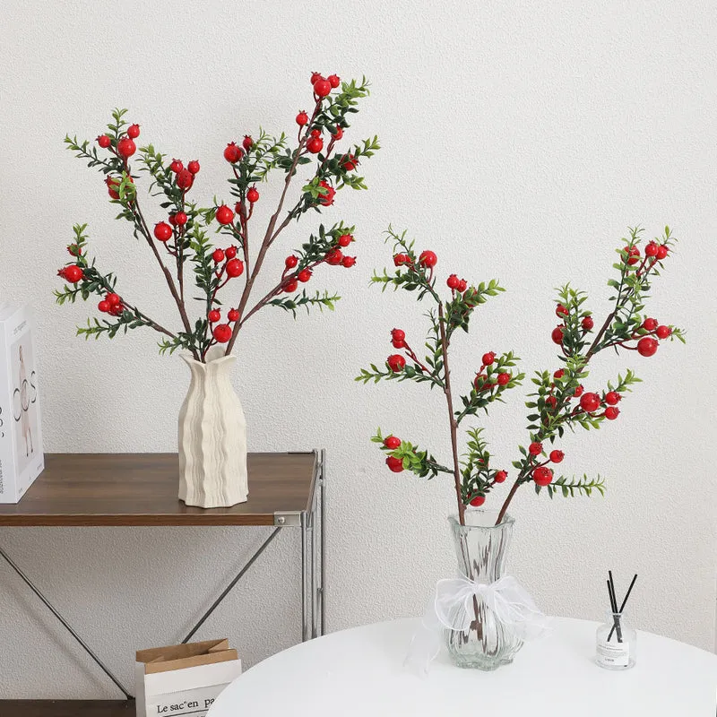 Artificial branch with glowing red berries
