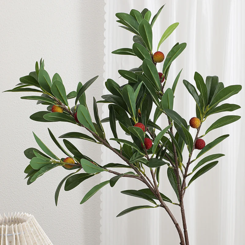 Artificial branch with decorative fruits