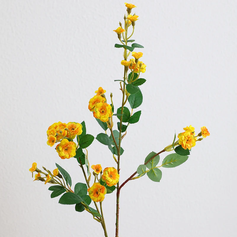 Artificial branch with decorative flowers