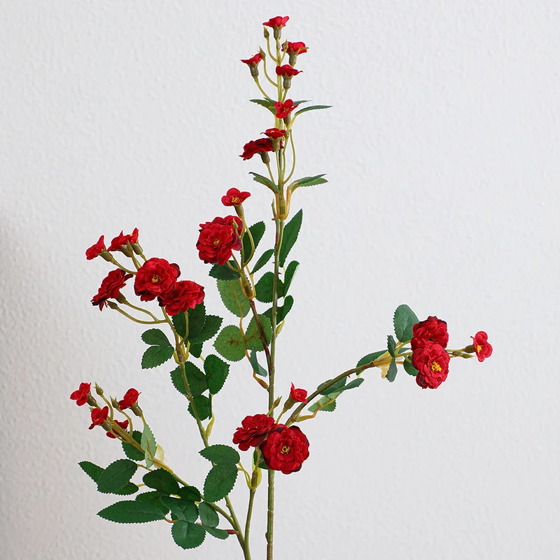 Artificial branch with decorative flowers