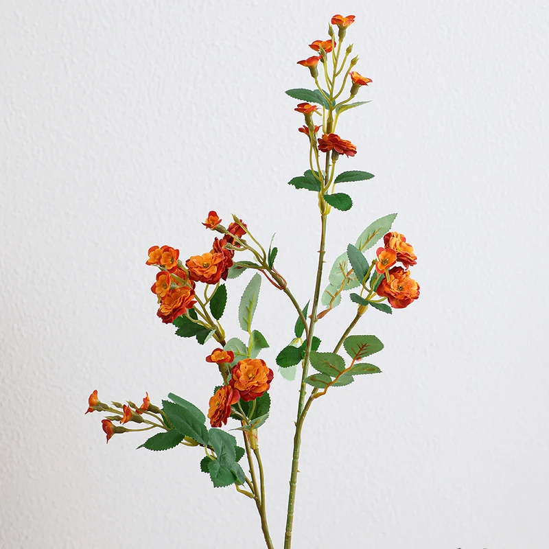 Artificial branch with decorative flowers