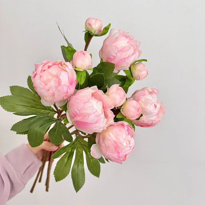 Artificial peony bouquet with delicate flowers and leaves