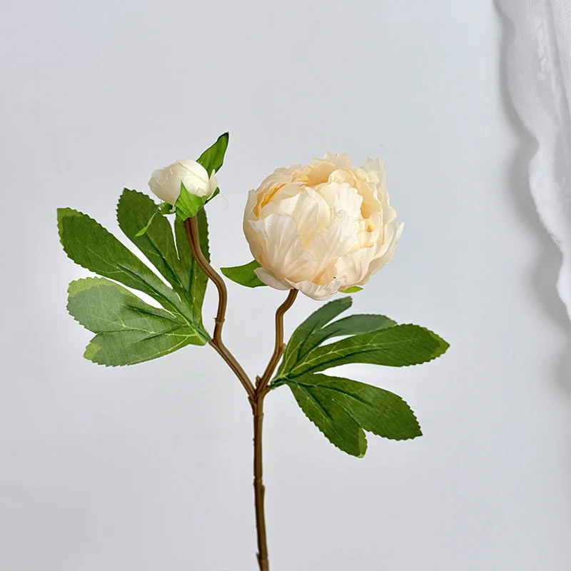 Artificial peony bouquet with delicate flowers and leaves