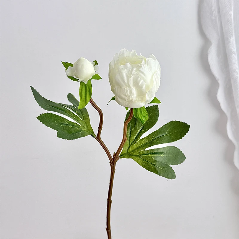 Artificial peony bouquet with delicate flowers and leaves