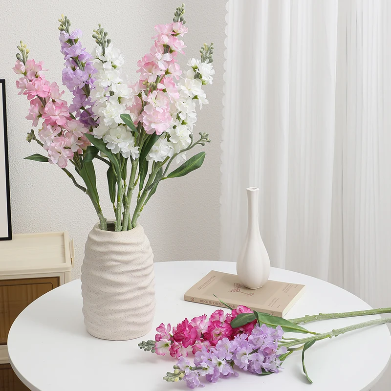 Artificial orchid bouquet with realistic flowers