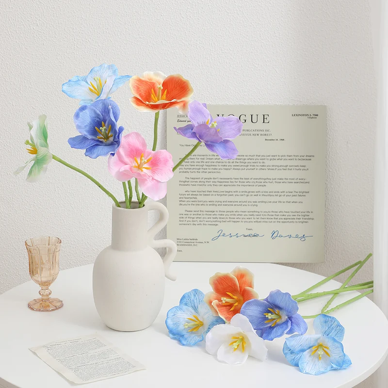 Artificial orchid flower branch with intricately detailed flowers