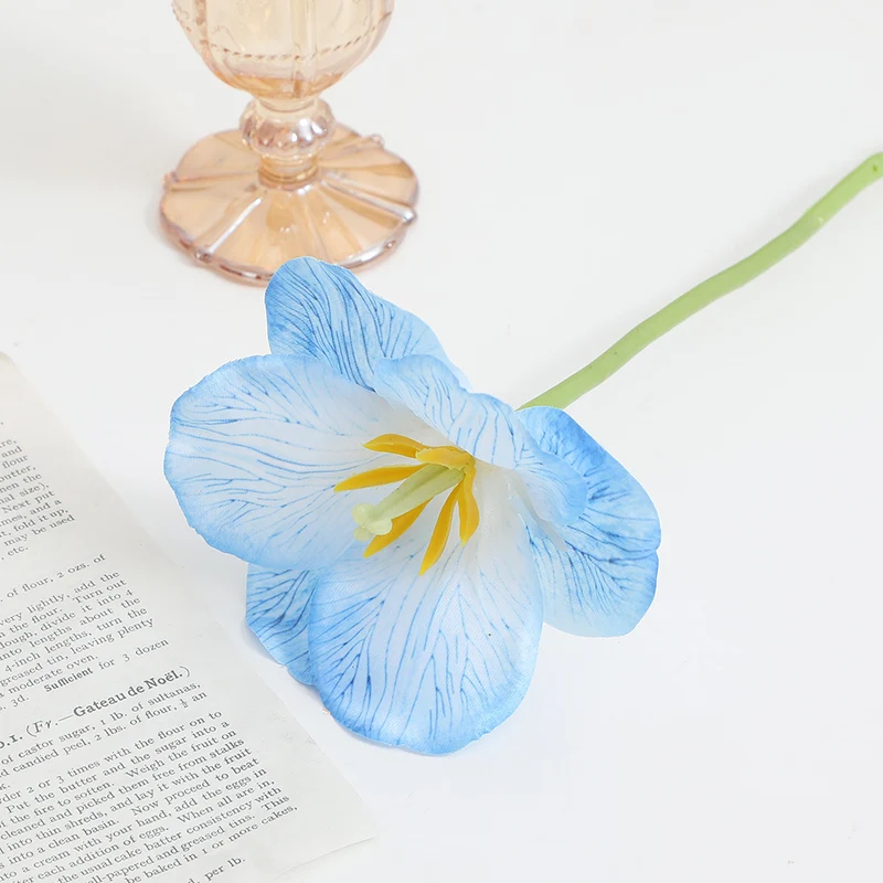 Artificial orchid flower branch with intricately detailed flowers