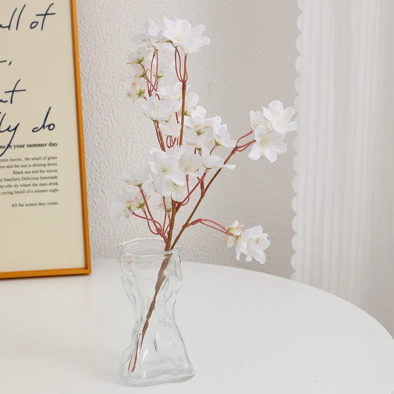 Artificial cherry blossom branch with detail-loving flowers