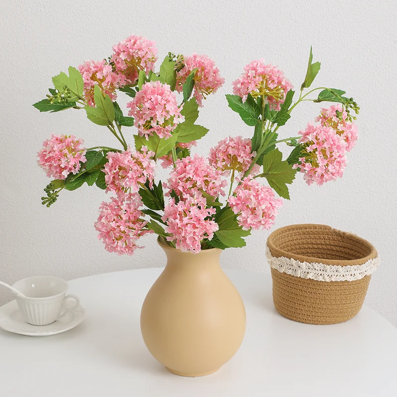 Artificial hydrangea branch with vibrant flowers and detailed leaves