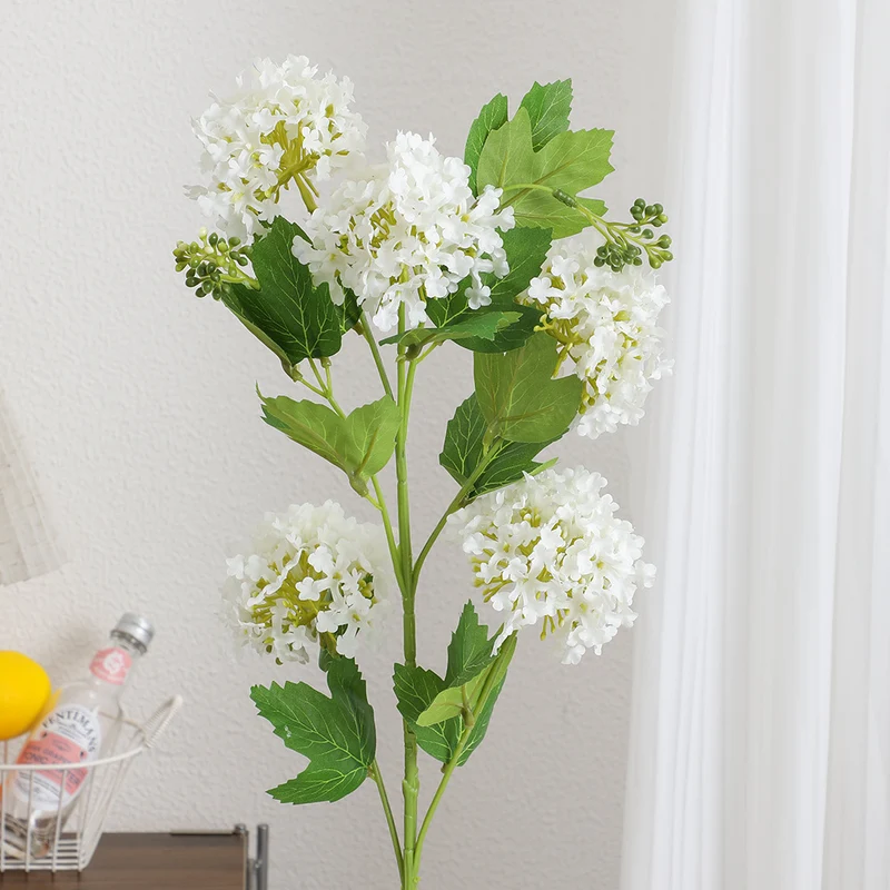 Artificial hydrangea branch with vibrant flowers and detailed leaves